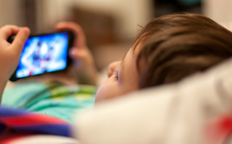 kid using mobile phone